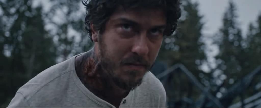 Close-up of Eric (Nat Wolff) displaying intense expression; screenshot via One Media.