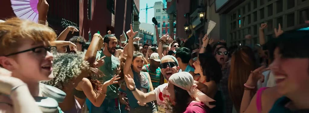 A vibrant crowd celebration scene featuring Durga (Sharvari), shot in Spain, from the “Champagne” song of Alpha (2026). Image credit: YRF/YouTube.