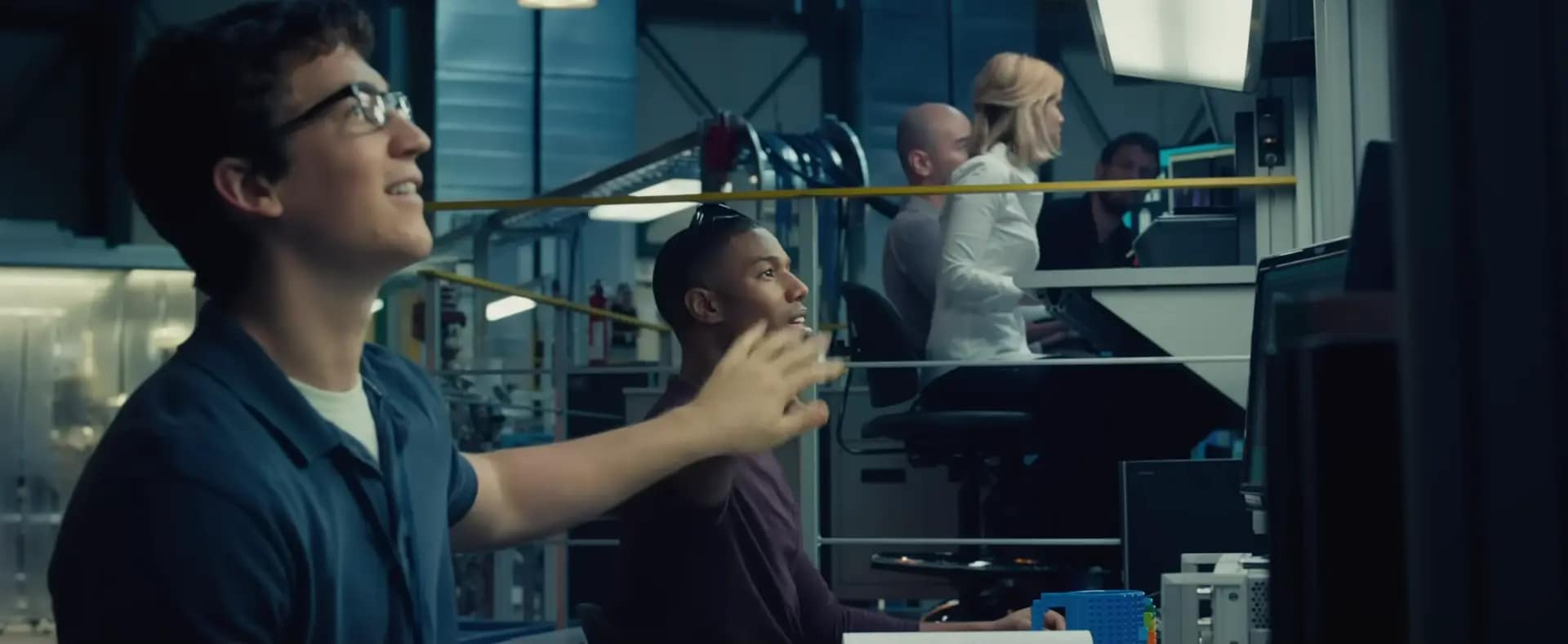 Miles Teller (as Reed Richards), working alongside Michael B. Jordan (Johnny Storm), and Kate Mara (Sue Storm) in Fantastic Four (2015). Image credit: Fantastic Four film still - via 20th Century Studios/YouTube.