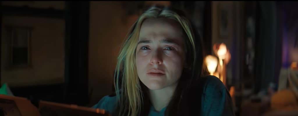 Danni Sanders (Zoey Deutch) in Not Okay, appearing shaken and teary-eyed.