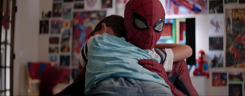 Warden Wayne as Spiderman embracing a terminally ill child in his bedroom, showcasing the emotional script choices of Gavin J. Konop.