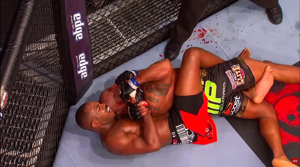 Jon Jones locking in a choke against Rampage Jackson at UFC 135. Image credit: UFC/YouTube