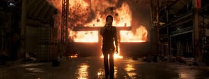 Shahid Kapoor walking away from a burning building in an O’Romeo film still.
