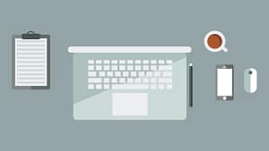 A minimalist vector illustration of a modern laptop workspace with a smartphone, mouse, notebook, and coffee cup on a clean grey desk.
